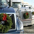 Trucks with wreaths attached to their fronts