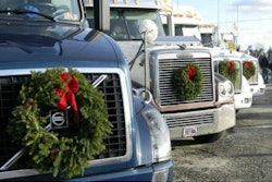 Trucks with wreaths attached to their fronts