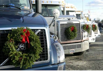 Trucks with wreaths attached to their fronts