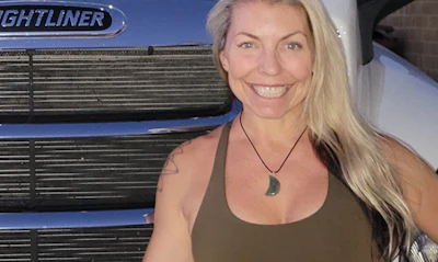 Woman in front of truck