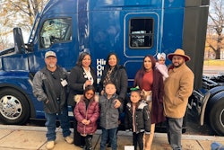 Contest winner and her family with the truck she won