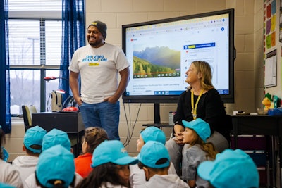 Truck driver speaks to third grade class