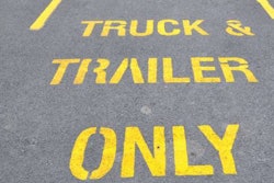 Truck and trailer parking spaces printed on pavement