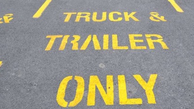 Truck and trailer parking spaces printed on pavement