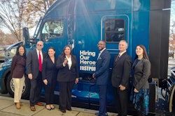 Gtoup of people in front of new Kenworth truck
