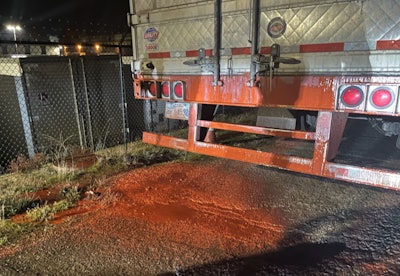 Red dye on back of trailer and highway