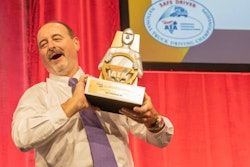 Truck driver with trophy