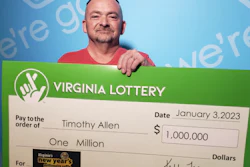 Truck driver holding big check for $1 million