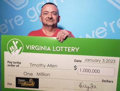 Truck driver holding big check for $1 million