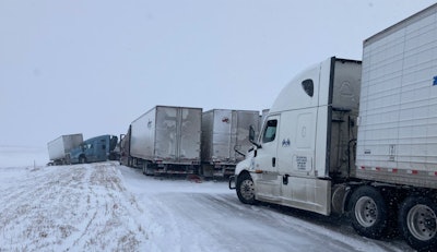 Trucks in accident on snow-covered interstate