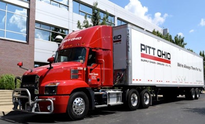 Tractor-trailer in front of office building