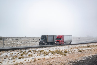 Two tractor-trailers on highway