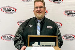 Scott Swenson holding Driver of the Year trophy