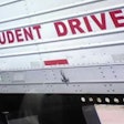 'Student Driver' sign on tractor-trailer