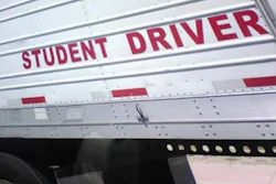 'Student Driver' sign on tractor-trailer