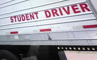 'Student Driver' sign on tractor-trailer