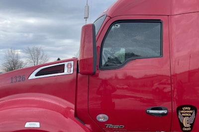 Bullet holes in window of a truck