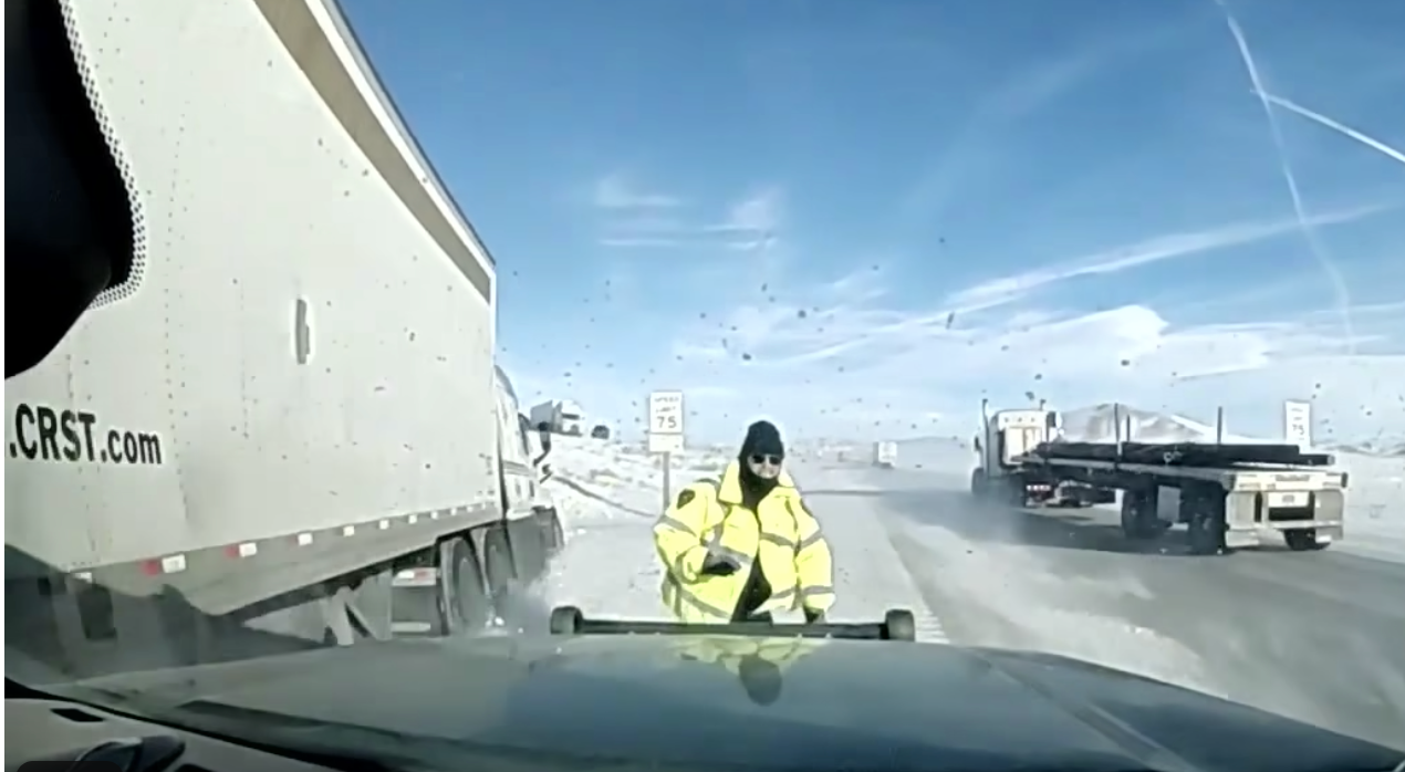 Wyoming Highway Patrol officer doges tractor-trailer on I-80