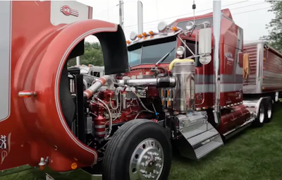 Red truck with its hood open