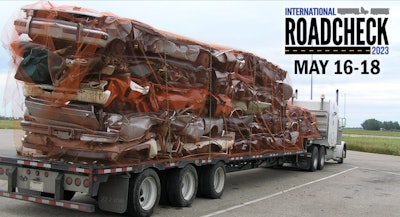 Loaded tractor-trailer and Roadhcheck graphic