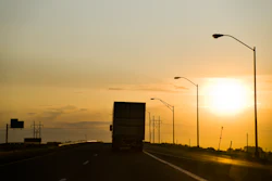 Big rig on the highway at sunset