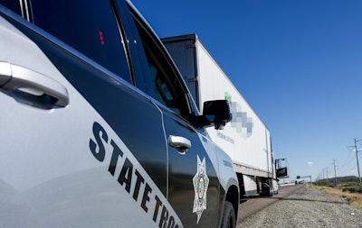 Arizona police car stopping a tractor-trailer