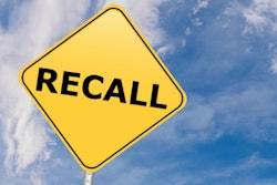 Yellow highway sign printed with 'Recall'