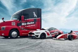 Mack Anthem truck and two race cars
