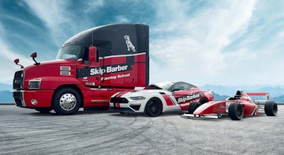 Mack Anthem truck and two race cars