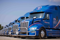 Line of blue Peterbilt trucks