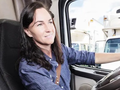 Woman at the wheel of a truck