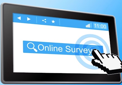 Hand touching computer screen saying 'Online survey'