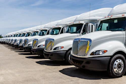 Long line of white trucks