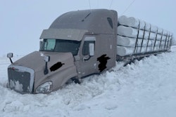 Tractor-trailer stuck in snow