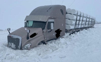 Tractor-trailer stuck in snow