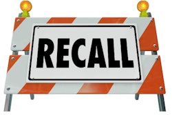 Road barrier with 'Recall' written on it