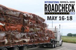Truckload of crushed cars and Roadcheck logo