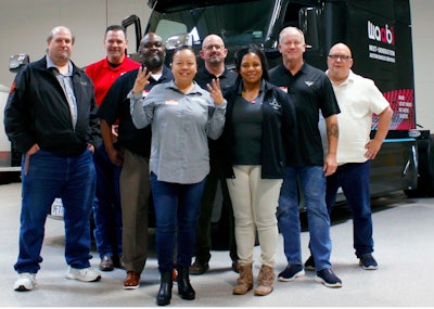 Truckers in front of truck