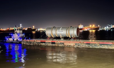 600,000-pound kiln on a barge at night