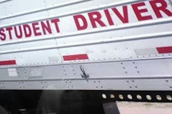 'Student Driver' sign on side of trailer