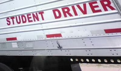 'Student Driver' sign on side of trailer