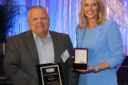 Ken Geer receives his Driver of the Year award from ATA President Shannon Newton