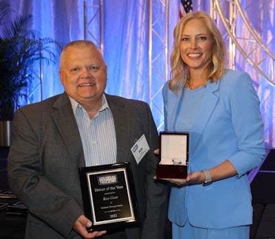 Ken Geer receives his Driver of the Year award from ATA President Shannon Newton