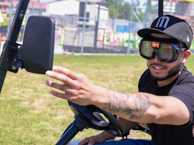 Student in golf cart