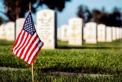 American glag in front of tombstones