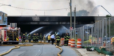 Firefighters at the scene of the I95 crash and fire in Philadelphia