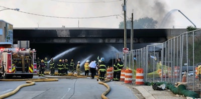 Firefighters at the scene of the I95 crash and fire in Philadelphia