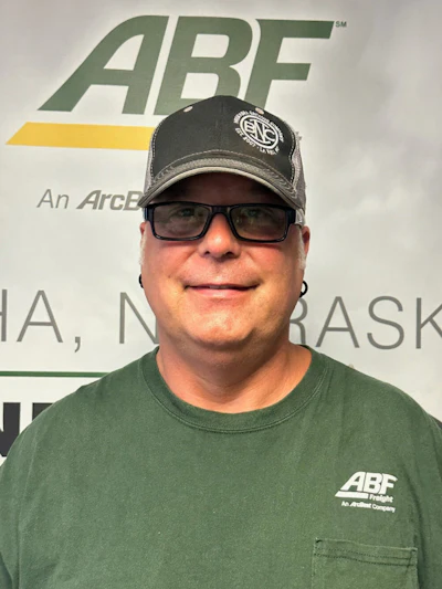 Truck driver in front of ABF sign