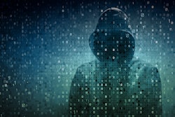 Dark hooded figure on a field of numbers