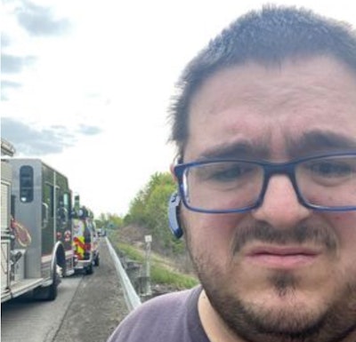 Trucker driver with fire trucks on I-64